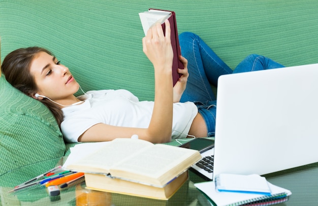 young girl using laptop at home 