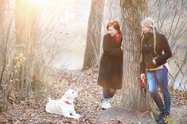 Young girl on a walk in the autumn garden