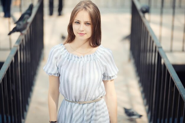 Young girl on a walk in the autumn park