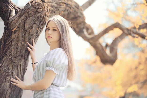 Young girl on a walk in the autumn