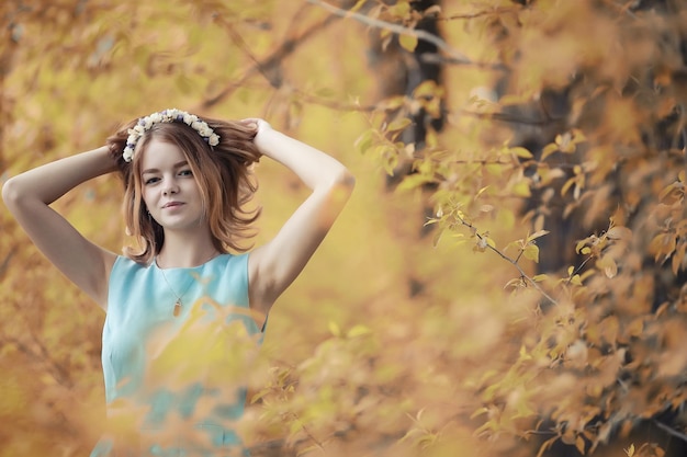 Young girl on a walk in the autumn