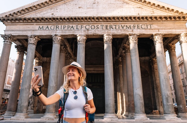 Young girl walks exploring the city with her backpack on a sunny day digital nomad