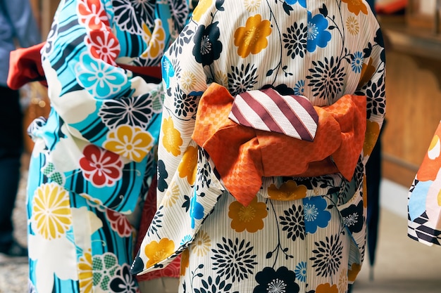 Young girl wearing Japanese kimono standing 