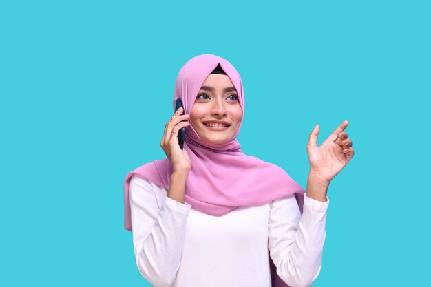 young girl wearing pink hijab pleasant conversation on phone indian pakistani model