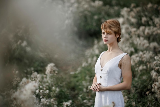 Young girl in white dress countryside portrait of a woman