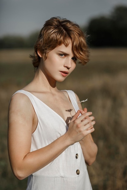 Young girl in white dress countryside portrait of a woman