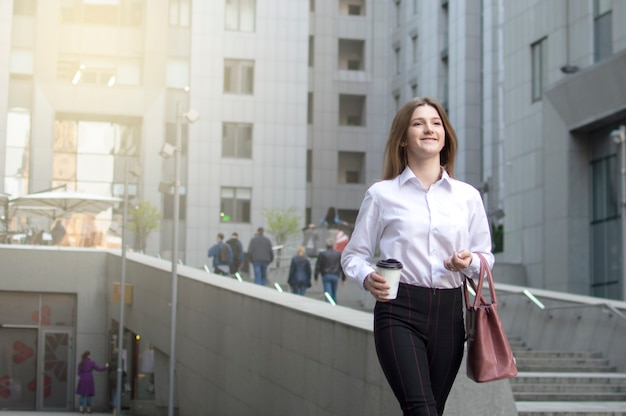 Premium Photo | Young girl with a bag walking