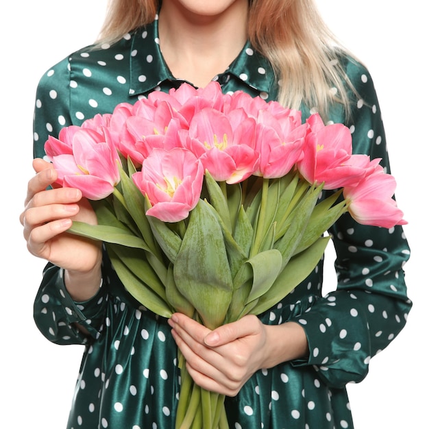 Young girl with beautiful tulips on white background closeup International Women's Day