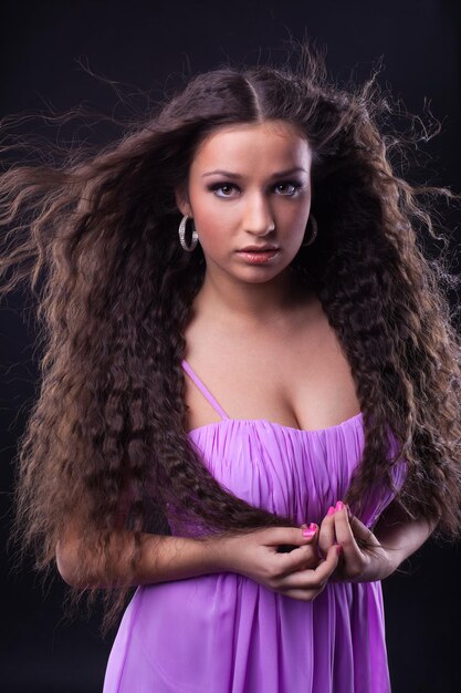 Young girl with beauty long hair look at you