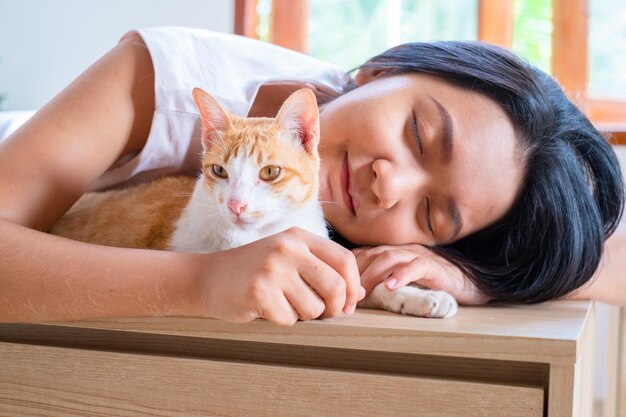 Young girl with a cat at home