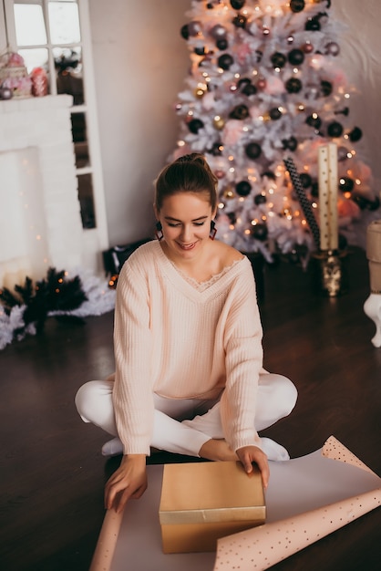 Young girl with christmas gifts. Newyear