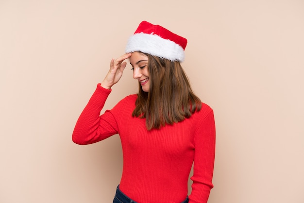 Young girl with Christmas hat laughing