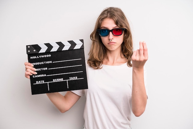 Young girl with a cinema clapper film or movie concept