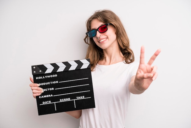 Young girl with a cinema clapper film or movie concept