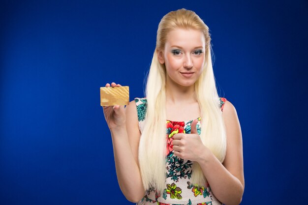 Young girl with credit card in hands