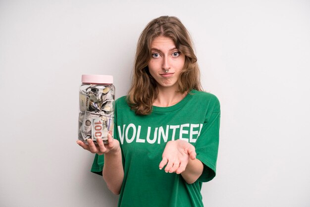 Young girl with a donation banknotes bottle volunteer concept