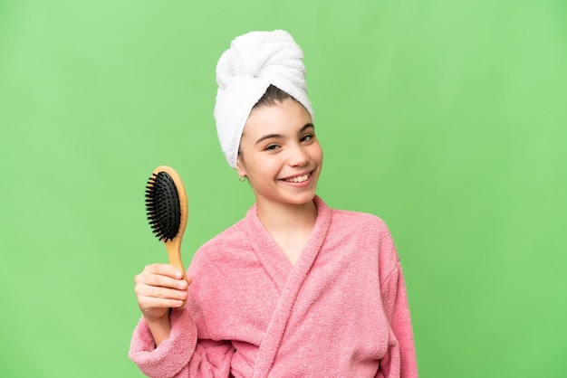 Young girl with hair comb smiling a lot