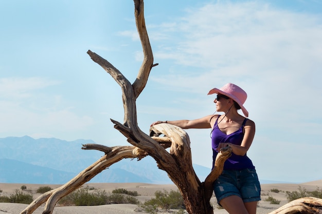 young girl with hat in the desert of Death Valley in America