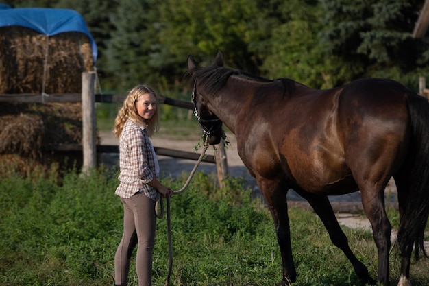 Young girl with her horse pretty girl with her horse