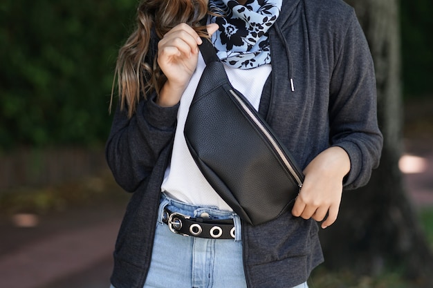 Young girl with leather fanny pack