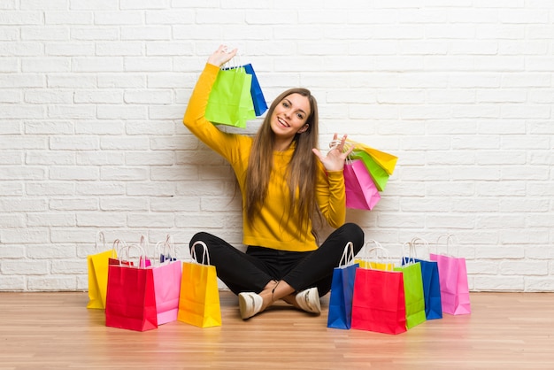 Young girl with lot of shopping bags