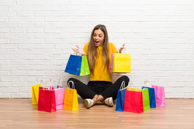 Young girl with lot of shopping bags