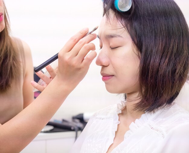 Young girl with makeup cosmetics