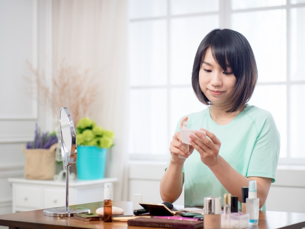 Young girl with makeup cosmetics