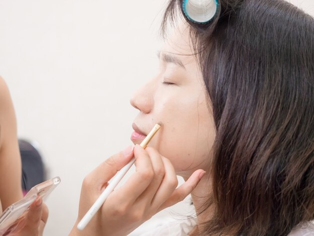 Young girl with makeup cosmetics