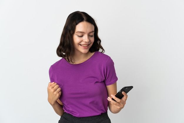 Young girl with phone on isolated white