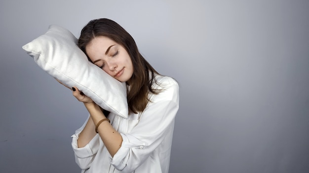 young girl with a pillow