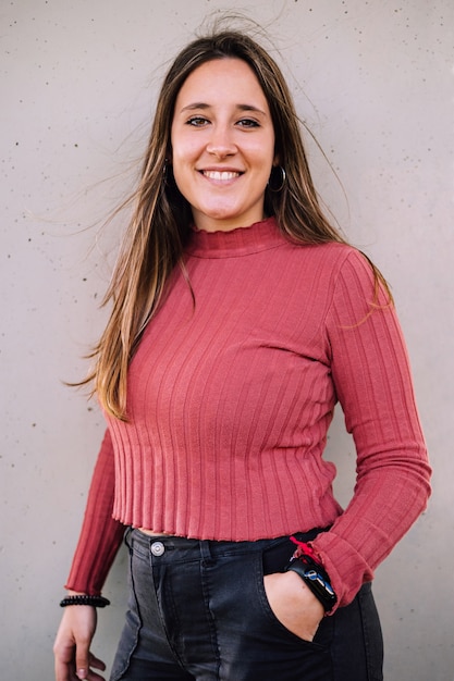 Young girl with pink shirt posing and smiling