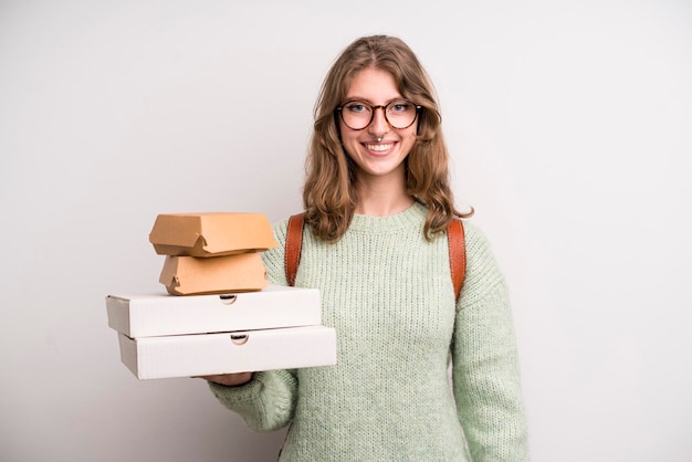 Young girl with pizzas and burgers take away fast food concept