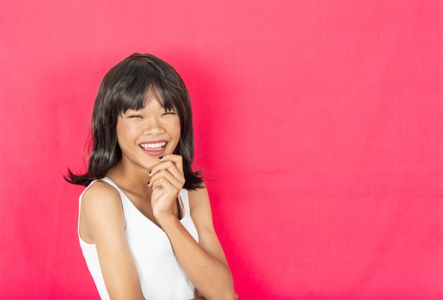 young girl with red wall