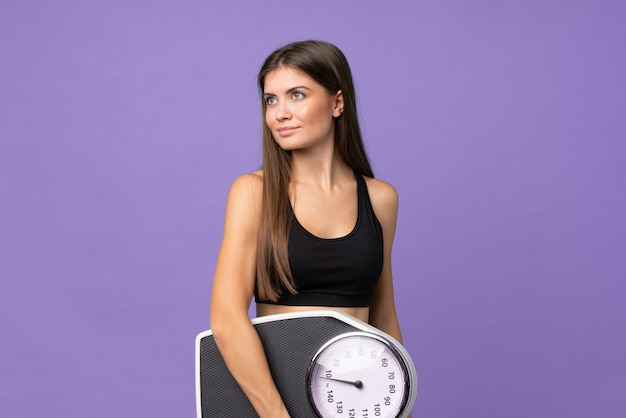 Young girl woman with weighing machine