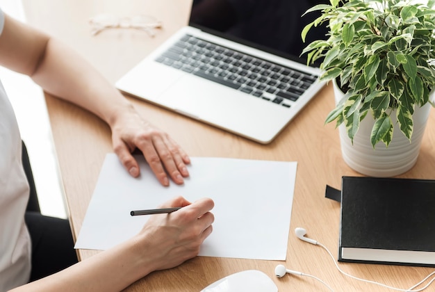 Young girl working at home office at the table