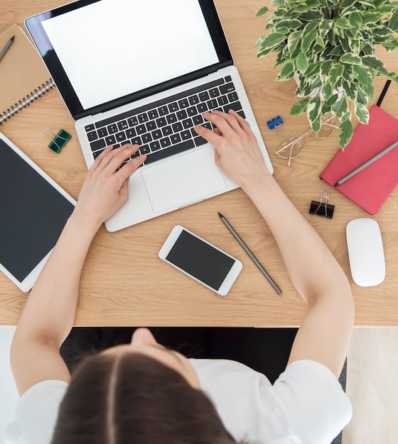 Young girl working at home office at the table