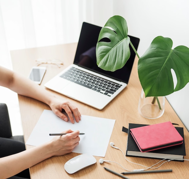 Young girl working at home office at the table