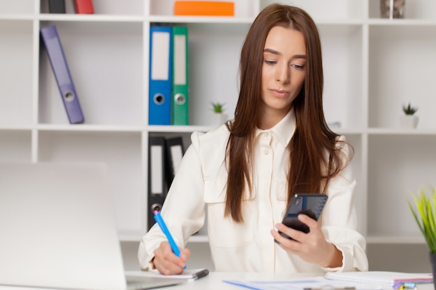 Young girl working in a light office