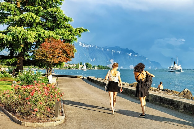 Young girls at the embankment at Geneva Lake in Vevey, Vaud canton, Switzerland