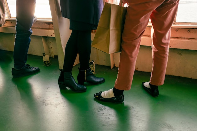 Young girls on the ferry with their purchases back to the office, back to school