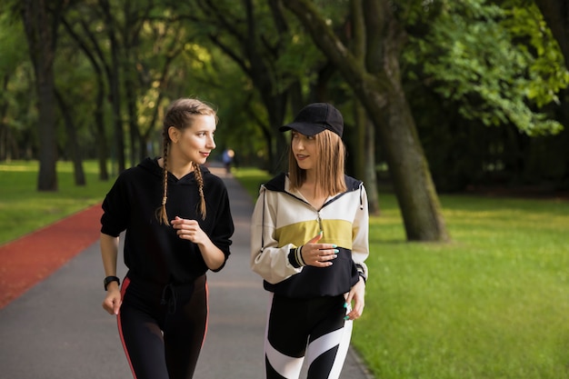 Young girls go in for sports in nature.