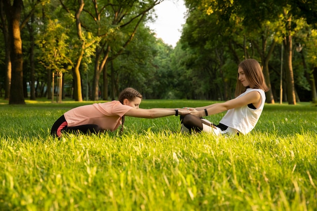 Young girls go in for sports in nature.