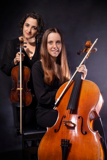 Young girls musicians with her instruments