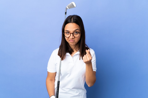 Young golfer woman over isolated colorful background making Italian gesture