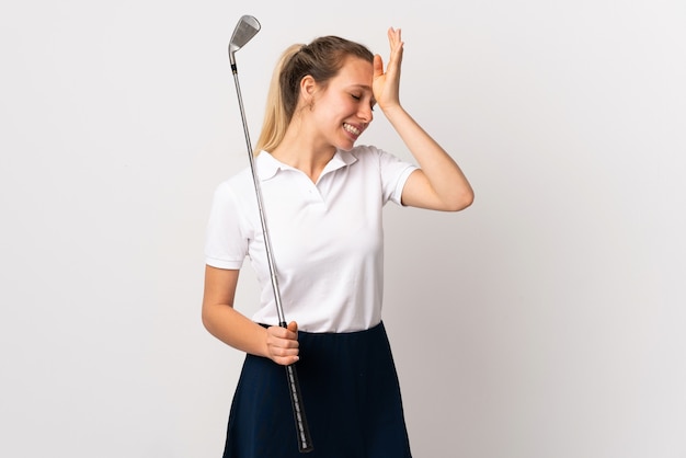 Young golfer woman over isolated white wall having doubts with confuse face expression