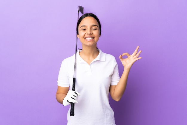 Young golfer woman with equipment