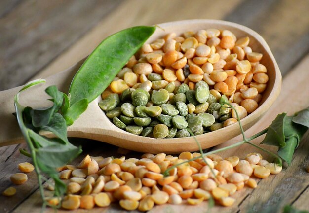 Young green peas in pods and dry grains