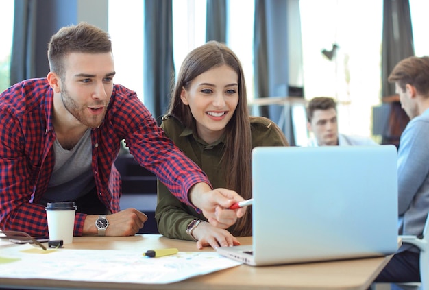 Young group of people doing their jobs on laptop