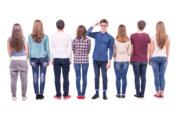 Young group standing with his back to the camera.